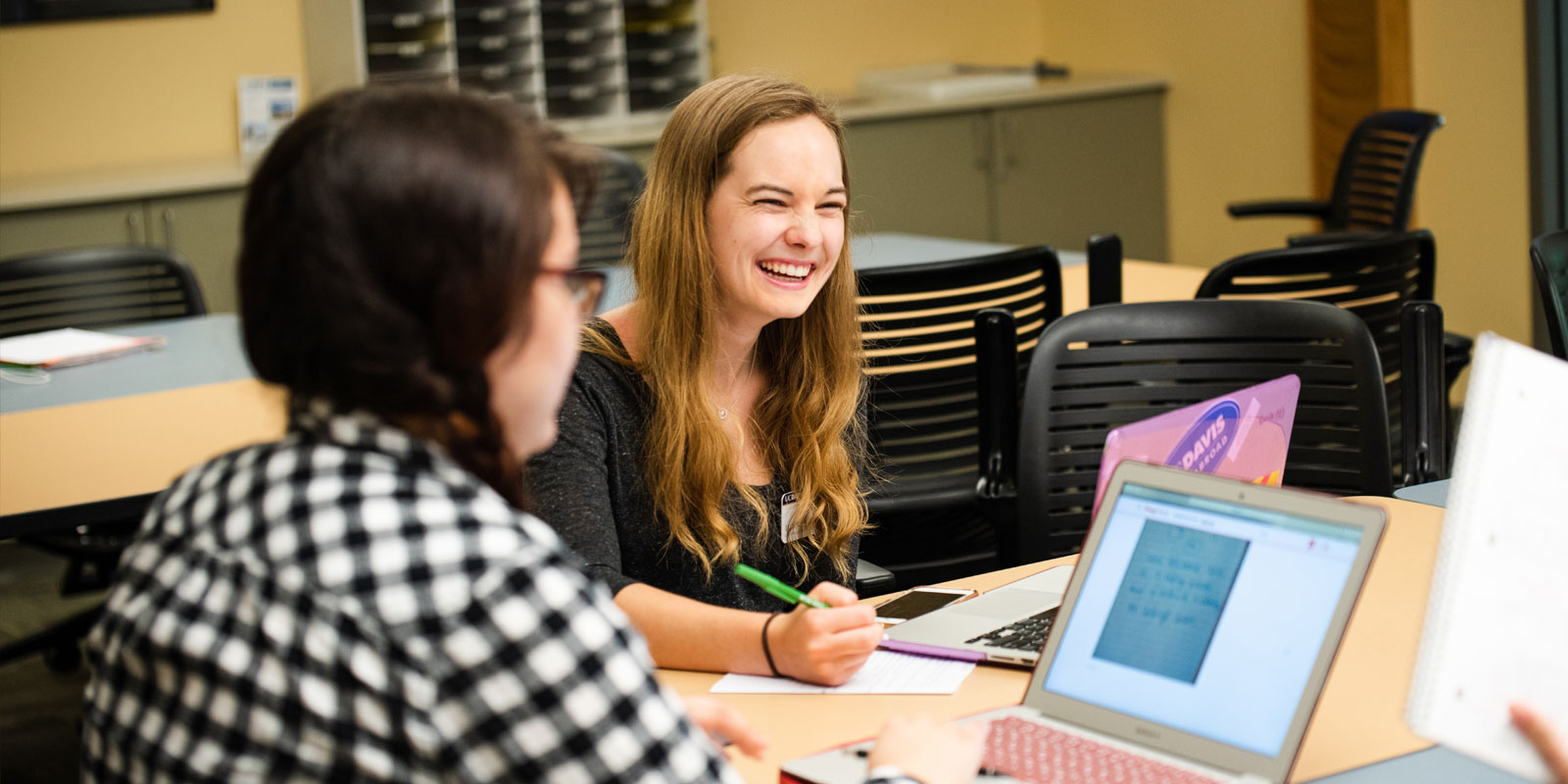 Photo: Peer math tutors work with residence hall students at the Residential Academic Center